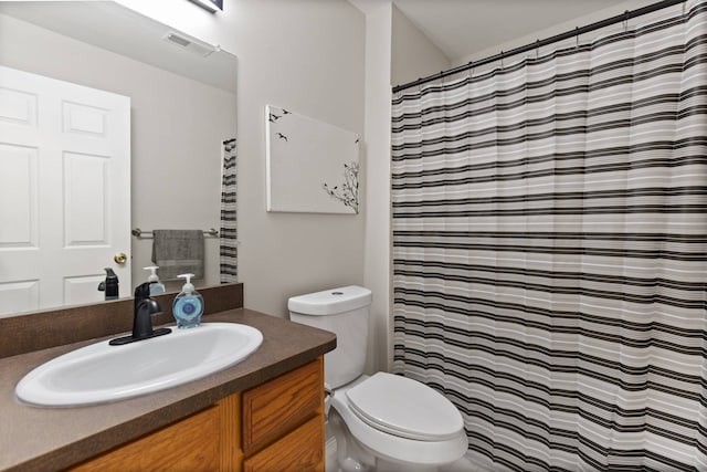 bathroom featuring visible vents, curtained shower, toilet, and vanity