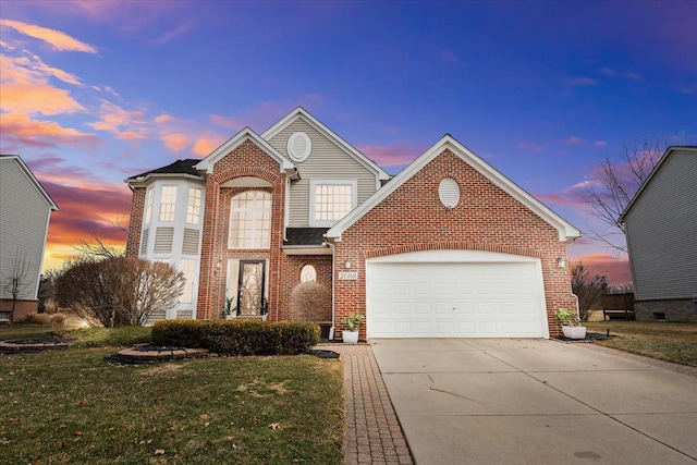 traditional home with concrete driveway, a garage, a lawn, and brick siding