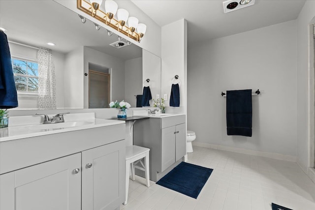 full bath featuring tile patterned floors, toilet, vanity, and baseboards