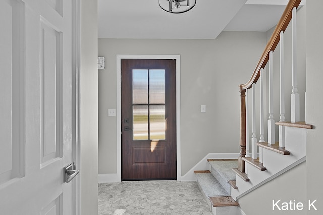 entryway with stairs and baseboards