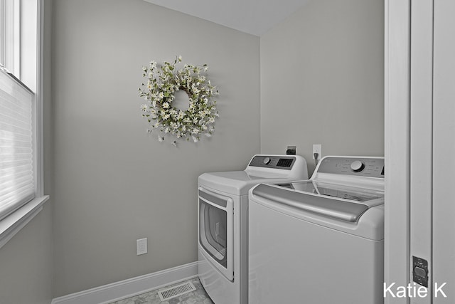 laundry room with plenty of natural light, washer and dryer, laundry area, and visible vents