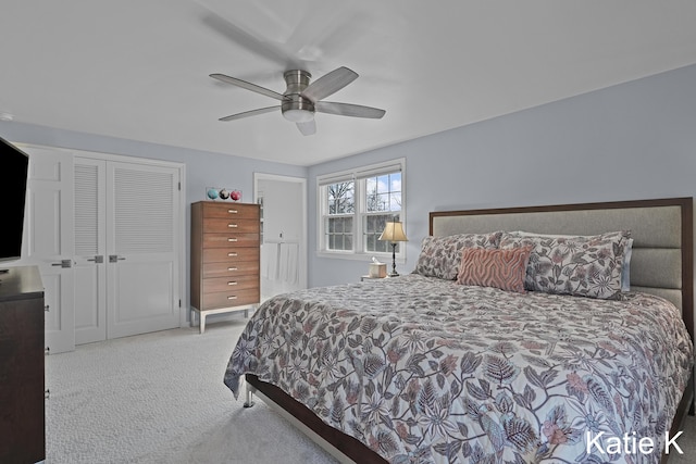 carpeted bedroom featuring a closet and ceiling fan