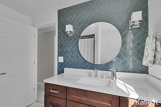 bathroom with vanity and wallpapered walls