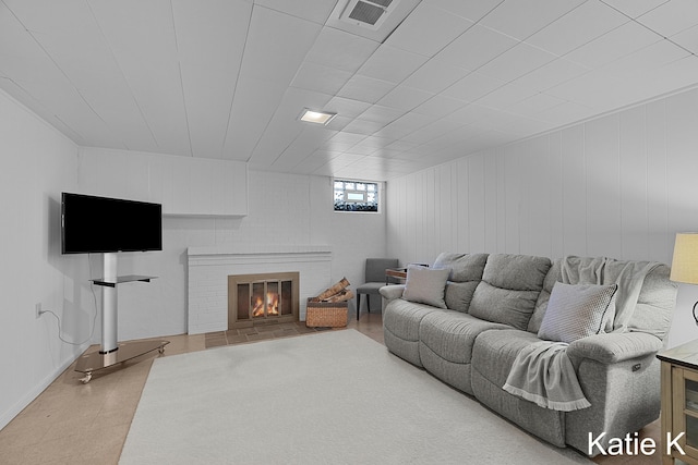 living area featuring a fireplace and visible vents