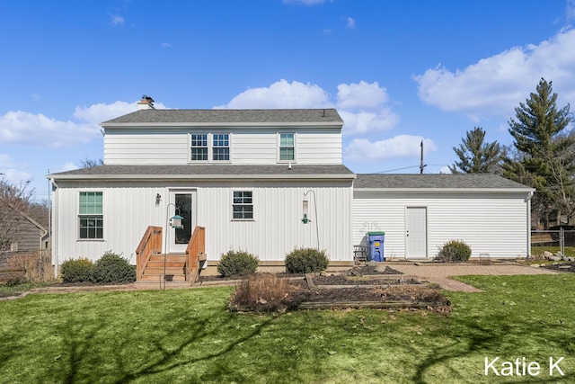 back of house featuring a yard, entry steps, and fence