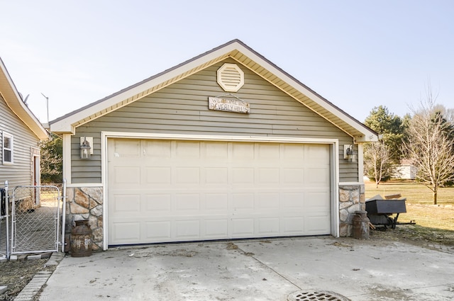 detached garage with a gate