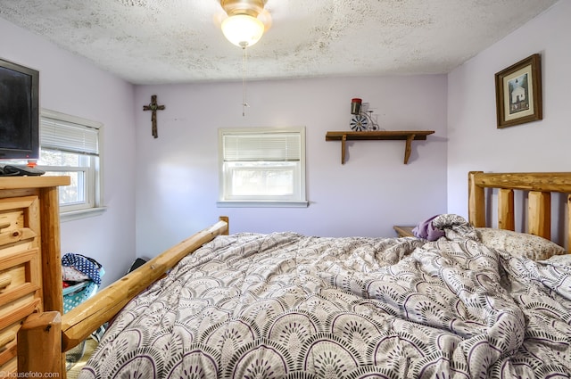 bedroom featuring a textured ceiling