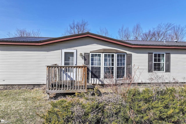 back of property with metal roof