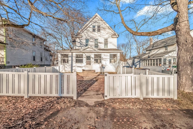 back of property featuring a fenced front yard