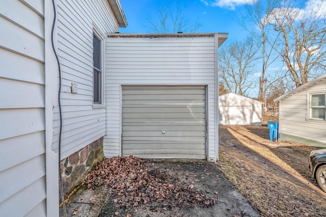 garage featuring driveway