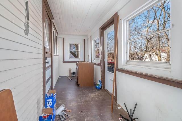 unfurnished sunroom with wooden ceiling