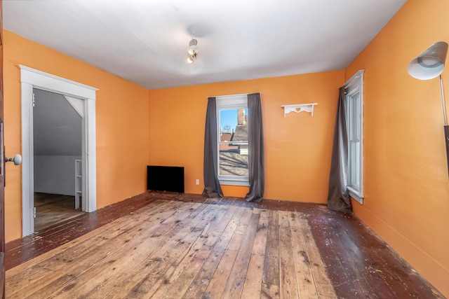 spare room with hardwood / wood-style flooring