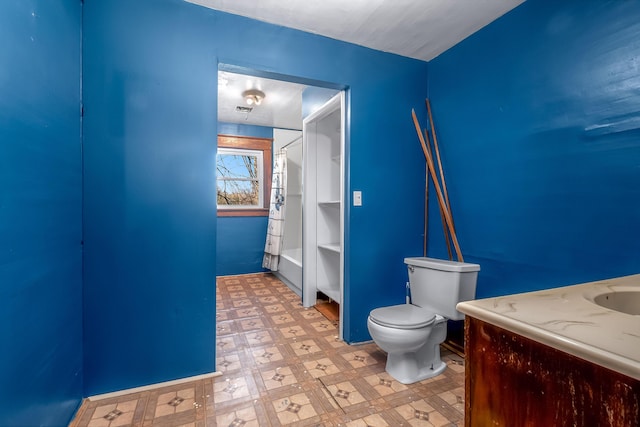 bathroom featuring tile patterned floors and toilet