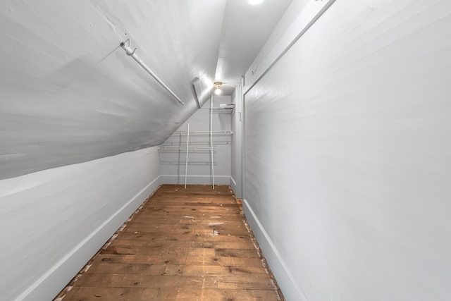 interior space featuring wood-type flooring and lofted ceiling