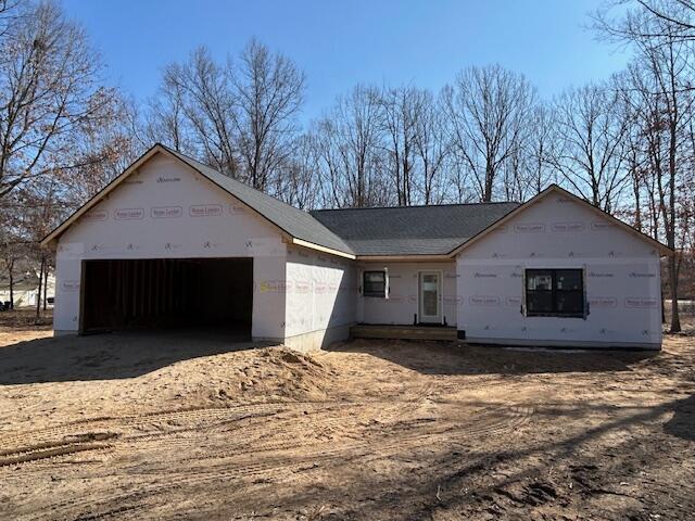 property under construction featuring an attached garage