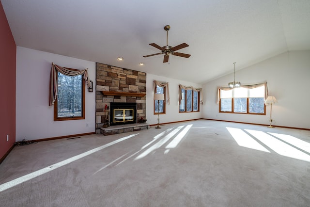 unfurnished living room with carpet, vaulted ceiling, a fireplace, and baseboards