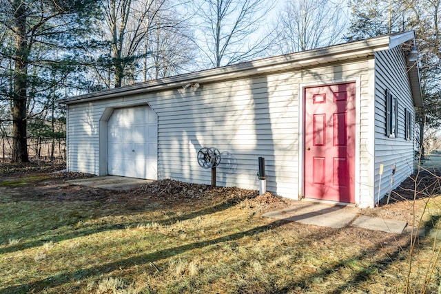 exterior space with an outdoor structure and driveway