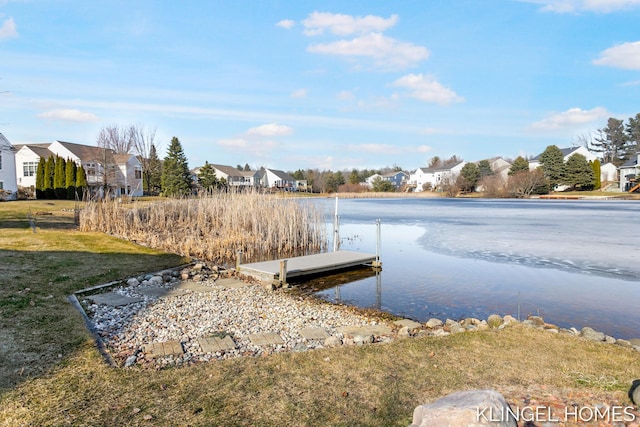 dock area with a yard and a residential view