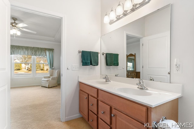 bathroom featuring a sink, a ceiling fan, ornamental molding, and double vanity