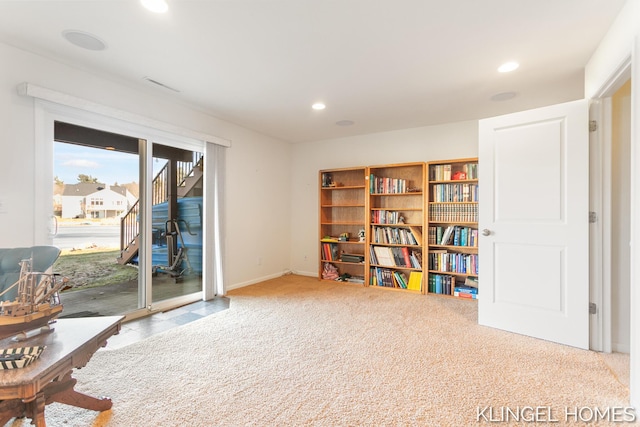 living area with carpet flooring, recessed lighting, and visible vents