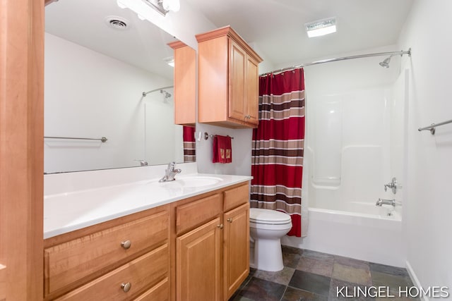 bathroom with visible vents, stone finish flooring, toilet, vanity, and shower / bathtub combination with curtain