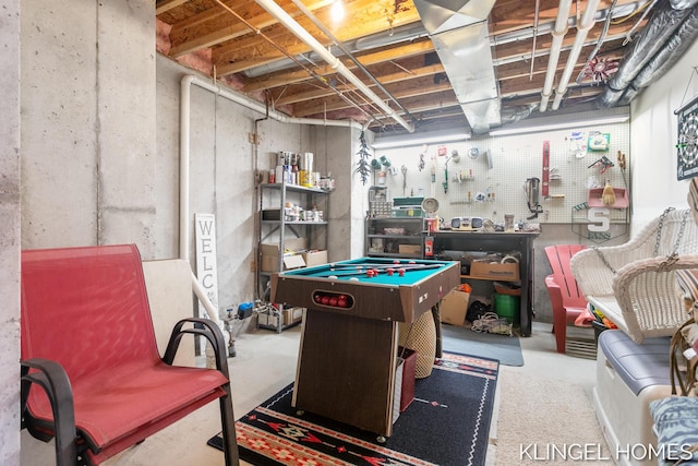 recreation room featuring a workshop area, concrete floors, and billiards