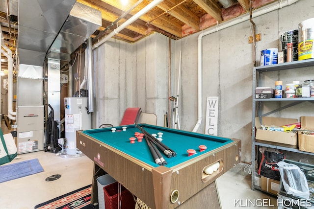 rec room with pool table, gas water heater, and concrete flooring