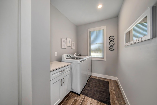 washroom with baseboards, washing machine and clothes dryer, dark wood finished floors, cabinet space, and recessed lighting