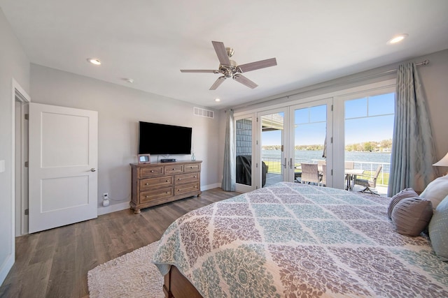 bedroom with wood finished floors, visible vents, recessed lighting, french doors, and access to outside