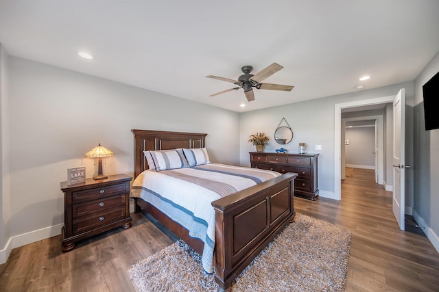 bedroom featuring recessed lighting, baseboards, and dark wood finished floors