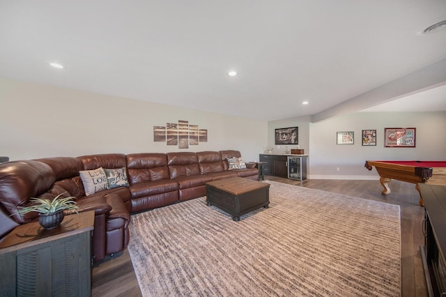 living room with visible vents, recessed lighting, a bar, and dark wood-type flooring