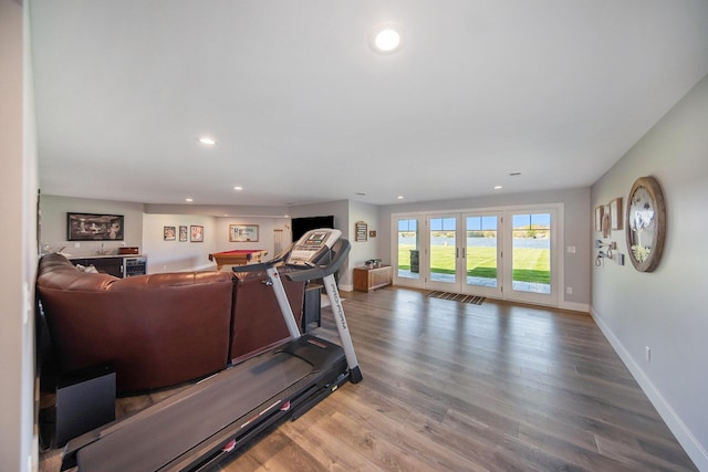 workout area with recessed lighting, wood finished floors, and baseboards