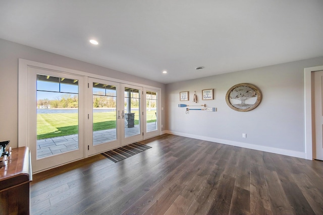 interior space with recessed lighting, baseboards, and dark wood-style flooring