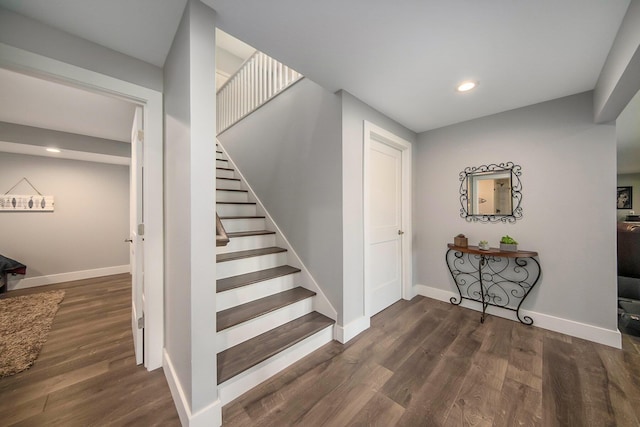 stairs featuring recessed lighting, baseboards, and wood finished floors