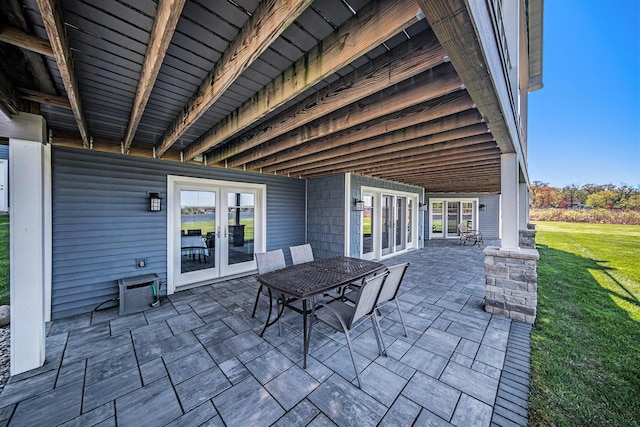 view of patio with outdoor dining area and french doors