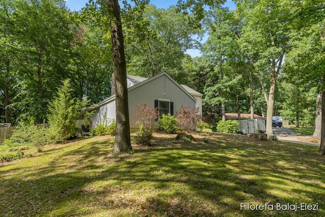 view of side of property featuring a yard