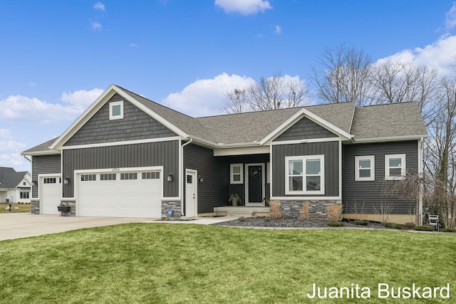 craftsman inspired home featuring board and batten siding, a front lawn, concrete driveway, a garage, and stone siding