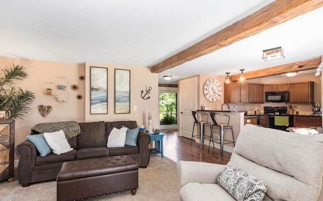 living room featuring beam ceiling