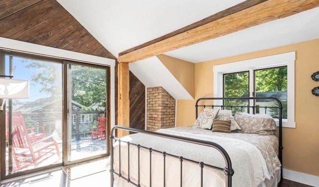 bedroom with lofted ceiling with beams, baseboards, and access to exterior