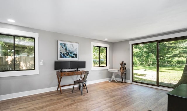 office area featuring recessed lighting, baseboards, and wood finished floors