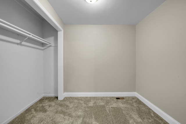 interior space featuring carpet flooring and visible vents