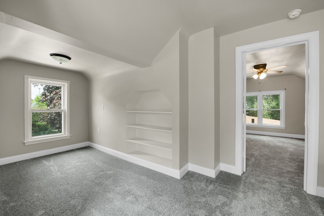 bonus room featuring carpet flooring, vaulted ceiling, built in features, and baseboards