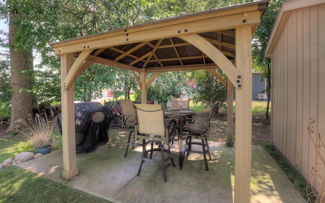 view of patio featuring a gazebo and outdoor dining area