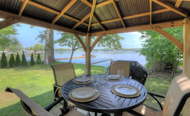 view of patio / terrace with a gazebo, a water view, and area for grilling