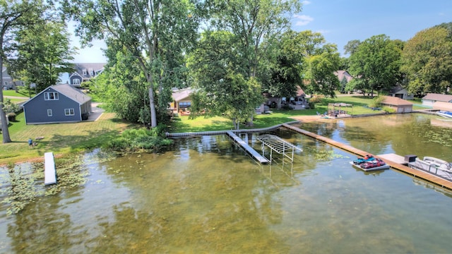 dock area featuring a yard and a water view