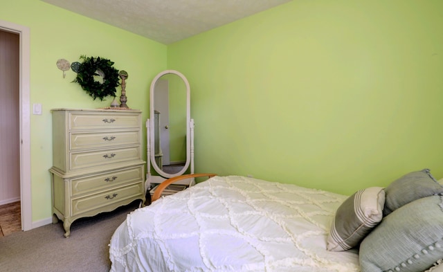 bedroom with carpet and baseboards