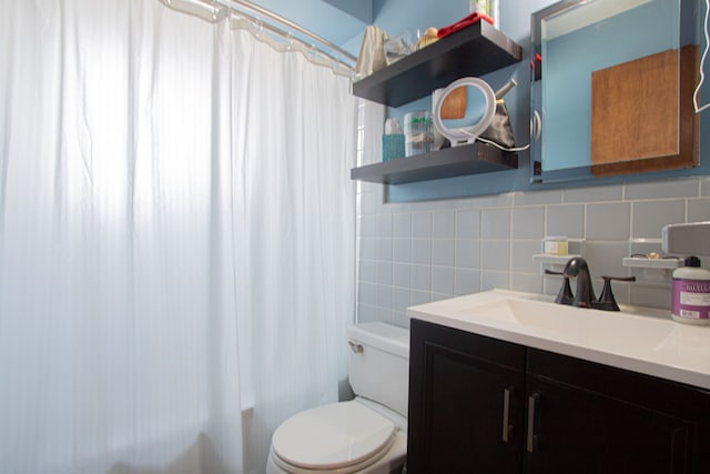 bathroom featuring toilet, shower / bath combo, tile walls, decorative backsplash, and vanity