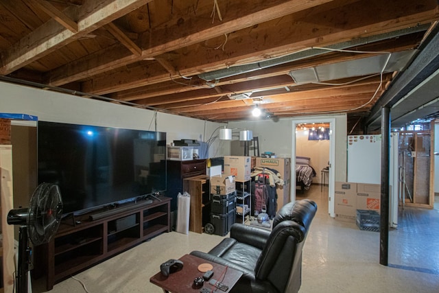 living area with concrete floors