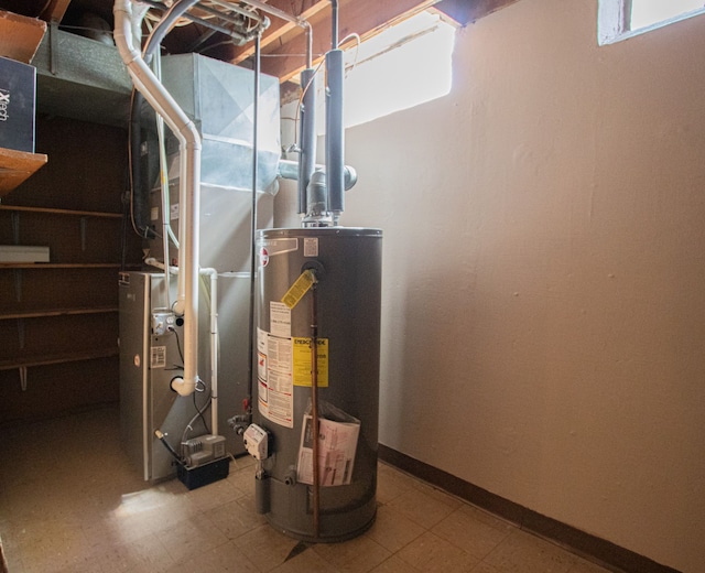 utility room featuring gas water heater