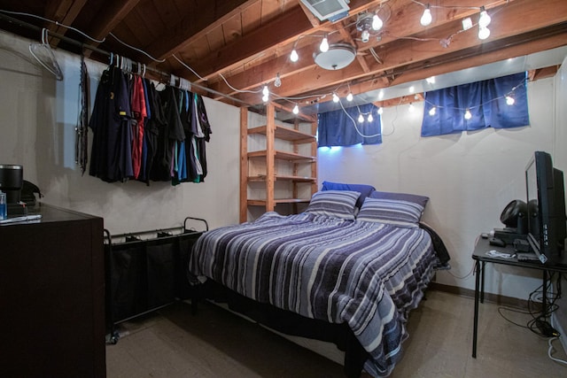 bedroom with baseboards and visible vents